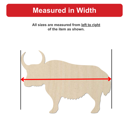 a wooden model of a horned animal, likely a yak or a bison, with measurements drawn on it.